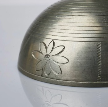 Close up of rounden metalwork bonbonjaire by Sylvia Stave.