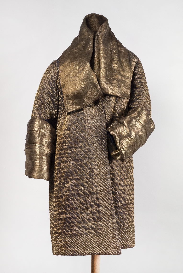 Beige coat in 1920s style.