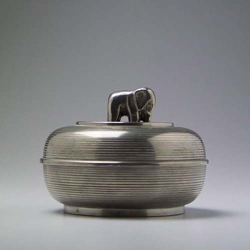 Metalwork tin jar by Sylvia Stave with elephant on the top lid.